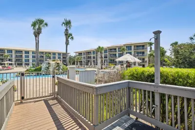 a balcony with a pool and a resort at HP 325 Sandy Bottoms by 30A Escapes in Rosemary Beach