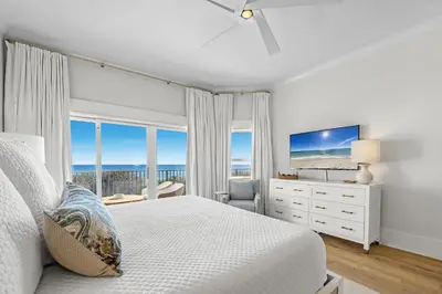 a white bedroom with a bed and a large window at The Legacy Unit 203 in Seagrove Beach