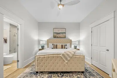 a bedroom with a bed and a ceiling fan at The Legacy Unit 203 in Seagrove Beach