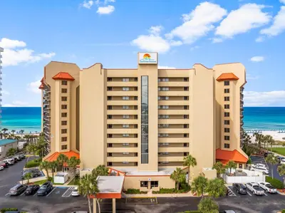 an aerial view of a hotel with the ocean in the background at Summerhouse Beach Resort by Panhandle Getaways in Panama City Beach