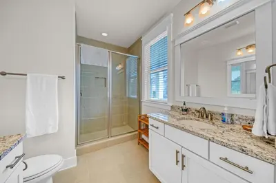 a bathroom with a shower and a toilet and a sink at Free Golf Cart, 5 min to Beach, Community Pool in Inlet Beach