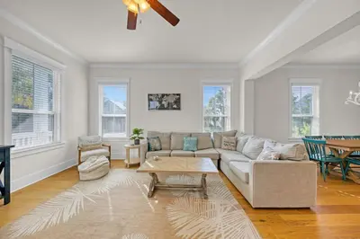 a living room with a couch and a table at Free Golf Cart, 5 min to Beach, Community Pool in Inlet Beach