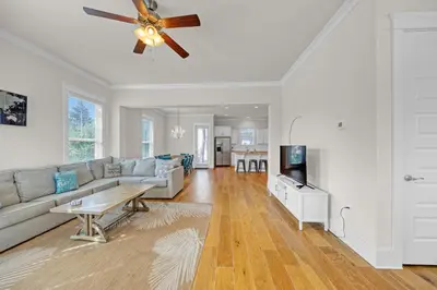 a living room with a couch and a ceiling fan at Free Golf Cart, 5 min to Beach, Community Pool in Inlet Beach