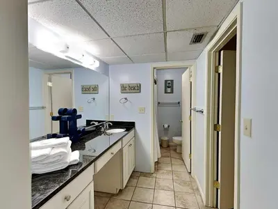 a bathroom with a sink and a toilet at Edgewater Villa #1607 in Panama City Beach