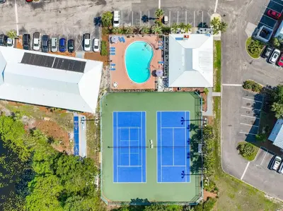 an overhead view of a pool with solar panels on it at Beachside Villas 1123- A Sandy Carol in Santa Rosa Beach