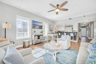 a living room with white furniture and a ceiling fan at Cassine Way 301 – 30A Blue Sky Breeze in Santa Rosa Beach