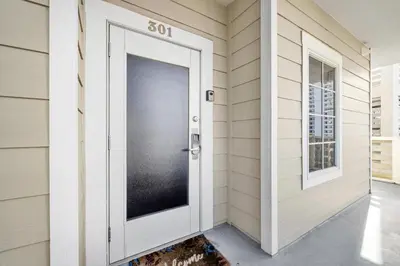 a door in a house with a speed limit sign on it at Cassine Way 301 – 30A Blue Sky Breeze in Santa Rosa Beach