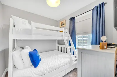 a white bunk bed in a room with a desk at Cassine Way 301 – 30A Blue Sky Breeze in Santa Rosa Beach