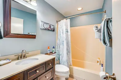 a bathroom with a sink and a toilet at Panama City Beach Condo with Pool and Beach Access! in Panama City Beach