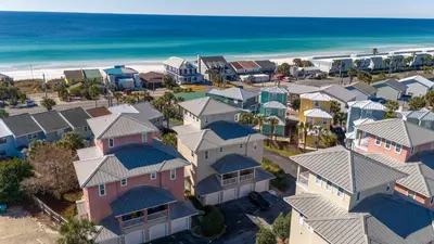 an aerial view of a row of houses next to the beach at Casa Del Mar in Panama City Beach