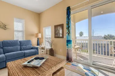 a living room with a couch and a table at Casa Del Mar in Panama City Beach