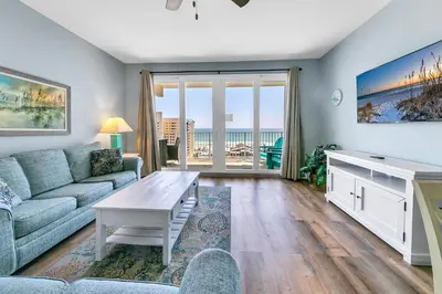 a living room with a couch and a table at Laketown Wharf 827 - Lifes A Beach by Emerald Coast Retreats in Panama City Beach