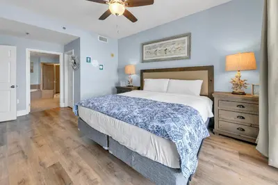 a bedroom with a bed and a ceiling fan at Laketown Wharf 827 - Lifes A Beach by Emerald Coast Retreats in Panama City Beach