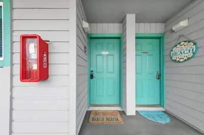 two doors on a house with a red mailbox at Nautical Watch E-3 in Panama City Beach