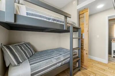 a bedroom with a bunk bed in a room at Laketown Wharf #1411 by Nautical Properties in Panama City Beach