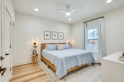 a bedroom with a bed and a window at Chic Panama City Beach Home, Walk to Laguna Beach! in Panama City Beach