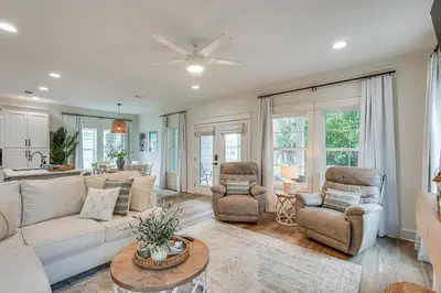a living room with a couch and two chairs at Chic Panama City Beach Home, Walk to Laguna Beach! in Panama City Beach