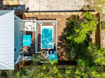 an aerial view of a house with a swimming pool at Southern Grove in Santa Rosa Beach