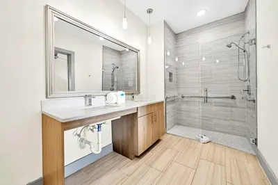 a bathroom with a sink and a shower at The Pointe 1-134 in Inlet Beach