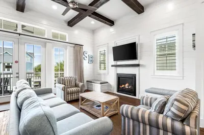 a living room with two couches and a fireplace at Endless Summer Nights at Seacrest in Inlet Beach