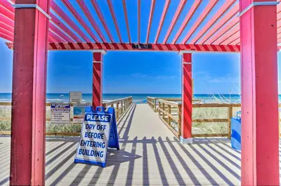 a view of the beach from a boardwalk at Walk to Shore Panama City Beach Condo with Pool in Panama City Beach