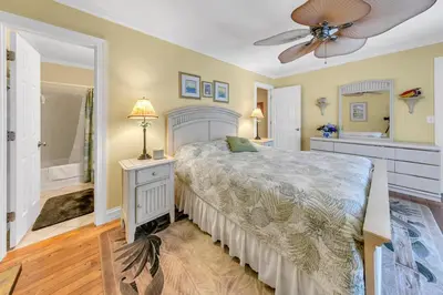 a bedroom with a bed and a ceiling fan at Cassine Gardens 189 in Santa Rosa Beach