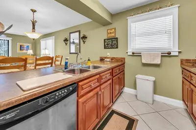 a kitchen with a sink and a dishwasher at Cassine Gardens 189 in Santa Rosa Beach