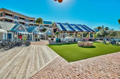 a resort with bikes parked outside of a building at Newly renovated overlooking the Seacrest Village Pool and Beach access in Rosemary Beach