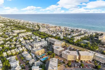 an aerial view of a city next to the ocean at Newly Renovated Village Condo! Easy Beach & Pool Access! in Rosemary Beach