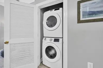 a washing machine and a dryer in a room at Overlooking 30A! Great Location! Easy Beach & Pool Access! in Rosemary Beach