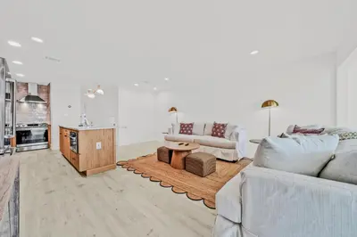 a living room with a couch and a table at Gulf Front, Stunning Views! Newly Renovated! Dolphin Watch #1 in Seacrest