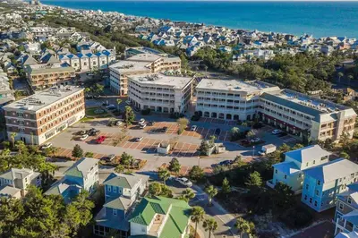 an aerial view of a city with buildings and the ocean at Village of South Walton Studio Ground Floor Easy Beach & Pool Access! in Rosemary Beach