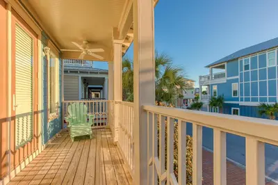 a porch with a green chair on a house at 50 yards to the Seacrest lagoon Pool, Walking distance to the beach! in Rosemary Beach