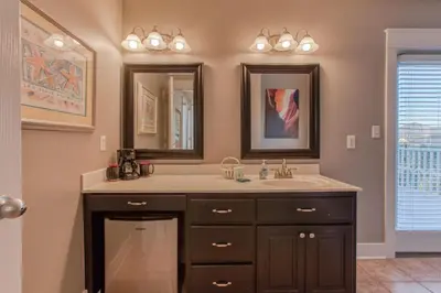 a bathroom with a sink and a mirror at 50 yards to the Seacrest lagoon Pool, Walking distance to the beach! in Rosemary Beach