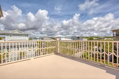 a balcony of a house with a white fence at 50 yards to the Seacrest lagoon Pool, Walking distance to the beach! in Rosemary Beach