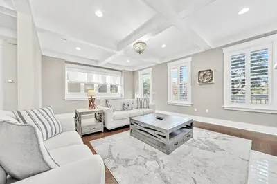a living room with white furniture and windows at NatureWalk on 30A Overlooking Beautiful Pond! in Seagrove Beach