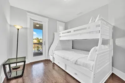 a bedroom with a white bunk bed and a window at NatureWalk on 30A Overlooking Beautiful Pond! in Seagrove Beach