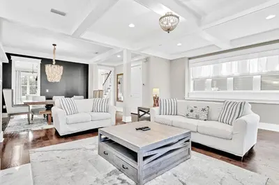 a living room with two white couches and a table at NatureWalk on 30A Overlooking Beautiful Pond! in Seagrove Beach