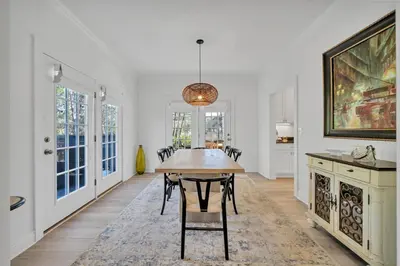 a dining room with a table and chairs at New Seagrove Beach Construction, Easy Beach Access, Professionally Decorated - Amazing Privacy! in Santa Rosa Beach