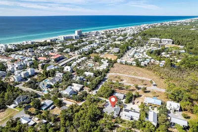 an aerial view of a residential area next to the ocean at New Seagrove Beach Construction, Easy Beach Access, Professionally Decorated - Amazing Privacy! in Santa Rosa Beach