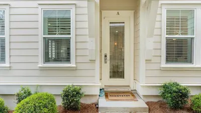 a house with a white door and two windows at Emerald Gem by AvantStay Pool Access 3mins to Beach in Panama City Beach