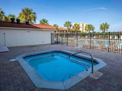 a swimming pool in the middle of a brick patio at Horizon South #31A in Panama City Beach