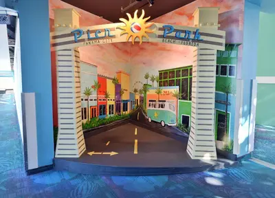 a entrance to a building with a painting of a bus at Beachfront Oasis at Splash Resort and Condos in Panama City Beach