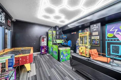 a childrens play room with arcade games on the wall at Gulf Crest 205 - Stunning Gulf Views - Huge Balcony in Panama City Beach