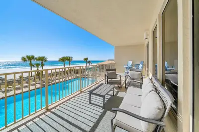 a balcony with a view of a pool and the ocean at Gulf Crest 205 - Stunning Gulf Views - Huge Balcony in Panama City Beach