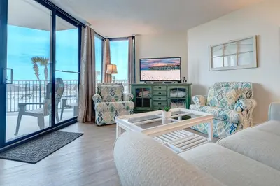 a living room with a couch and chairs and a television at Sunbird Resort! Ground-Floor Renovated Beach Condo! Free Beach Chairs! by Dolce Vita Getaways PCB in Panama City Beach