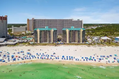 an aerial view of a beach in front of a resort at Sunbird Resort! Ground-Floor Renovated Beach Condo! Free Beach Chairs! by Dolce Vita Getaways PCB in Panama City Beach