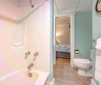 a bathroom with a bath tub and a toilet at Sunbird Resort! Ground-Floor Renovated Beach Condo! Free Beach Chairs! by Dolce Vita Getaways PCB in Panama City Beach