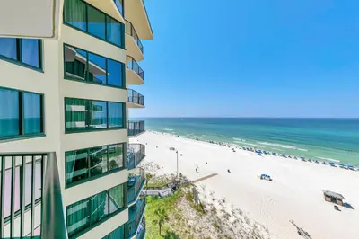a view of a building and the beach at Sunbird 906W in Panama City Beach