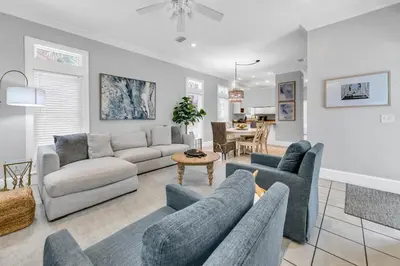 a living room with a couch and chairs and a table at Lily Pad in Panama City Beach
